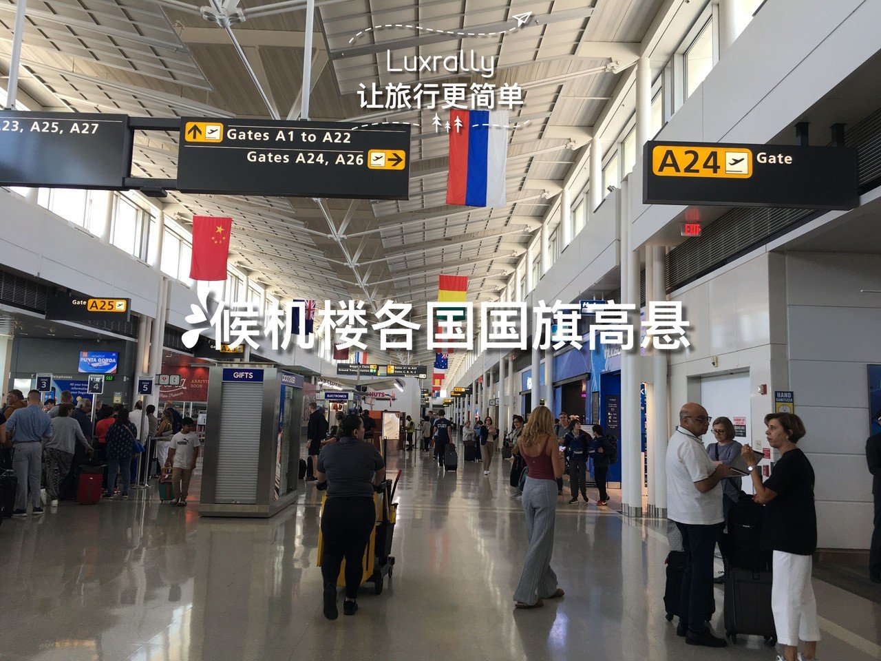 4 national flags of various countries hanging high in the terminal